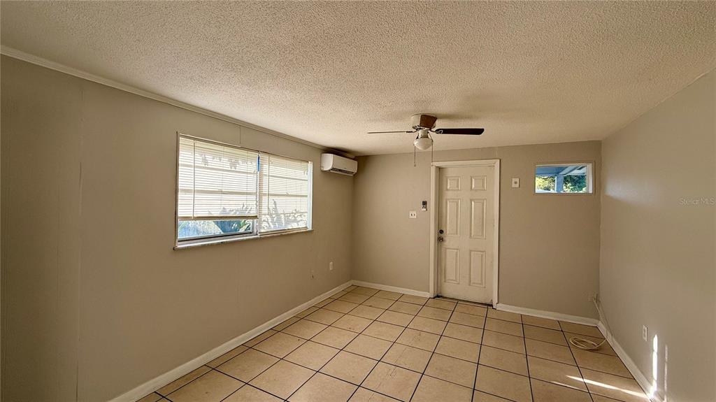 1314 North Combee Road, Unit 4 Lakeland, FL 33801 - Photo 10 of 12 a view of an empty room and window