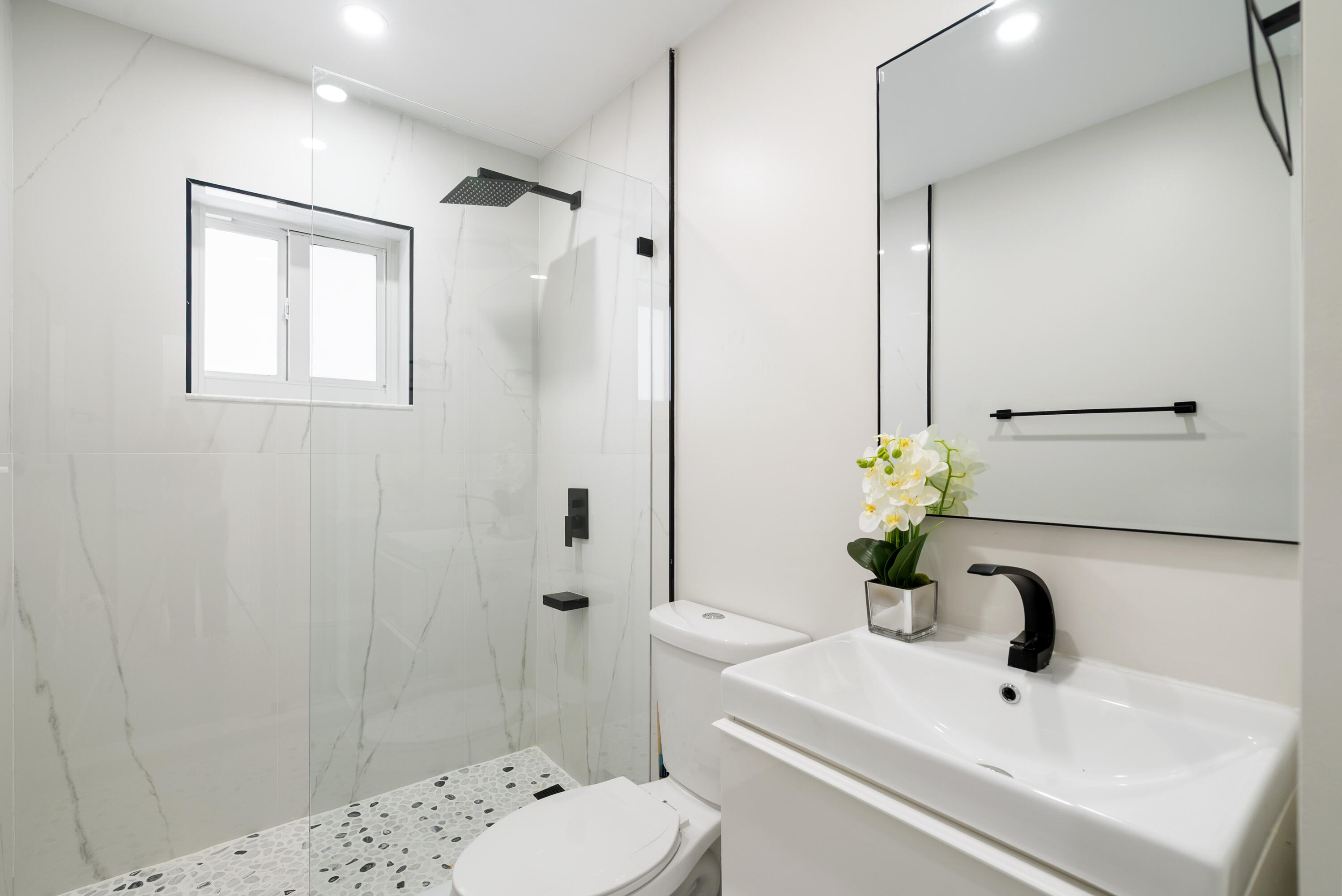 392 Laguna Avenue Key Largo, FL 33037 - Photo 21 of 42 a bathroom with a sink toilet and shower