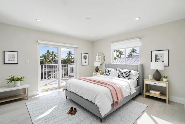 a bedroom with a balcony a bed and a couch