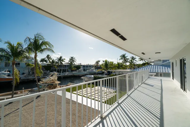 a view of balcony with furniture
