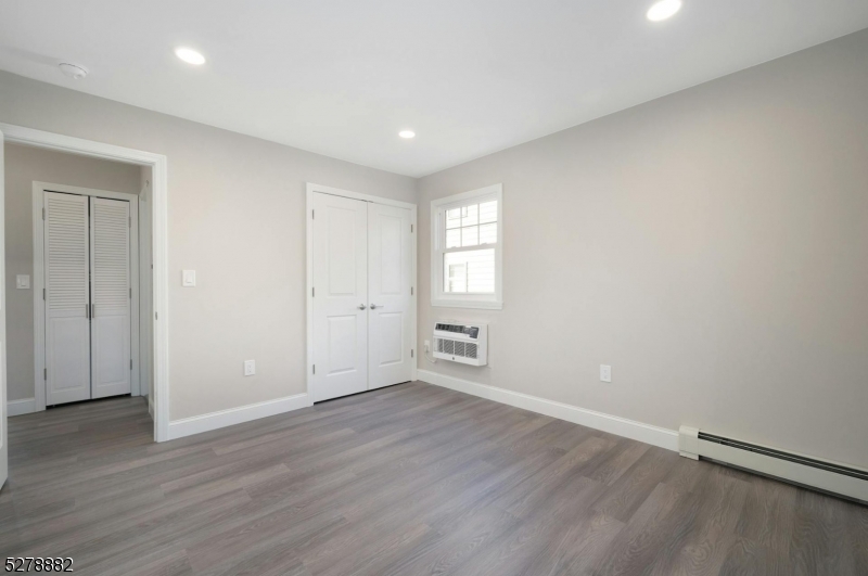 80 East Main Street, Unit 5 Mendham, NJ 07945 - Photo 14 of 28 wooden floor in an empty room with a window
