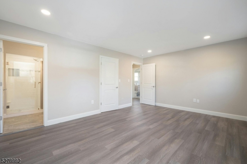 80 East Main Street, Unit 5 Mendham, NJ 07945 - Photo 18 of 28 a view of an empty room with wooden floor