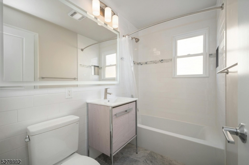 80 East Main Street, Unit 5 Mendham, NJ 07945 - Photo 21 of 28 a bathroom with a sink a toilet and shower