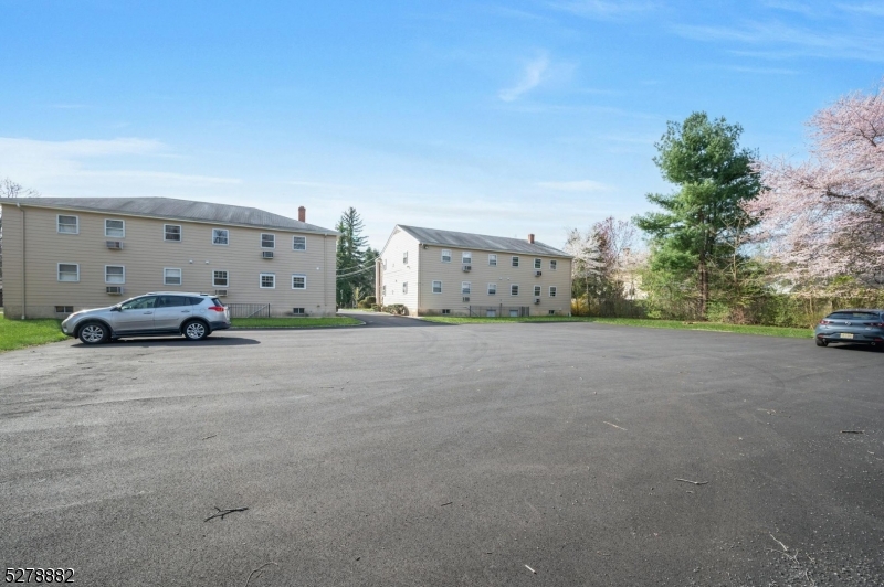80 East Main Street, Unit 5 Mendham, NJ 07945 - Photo 22 of 28 a view of car parked in front of a house