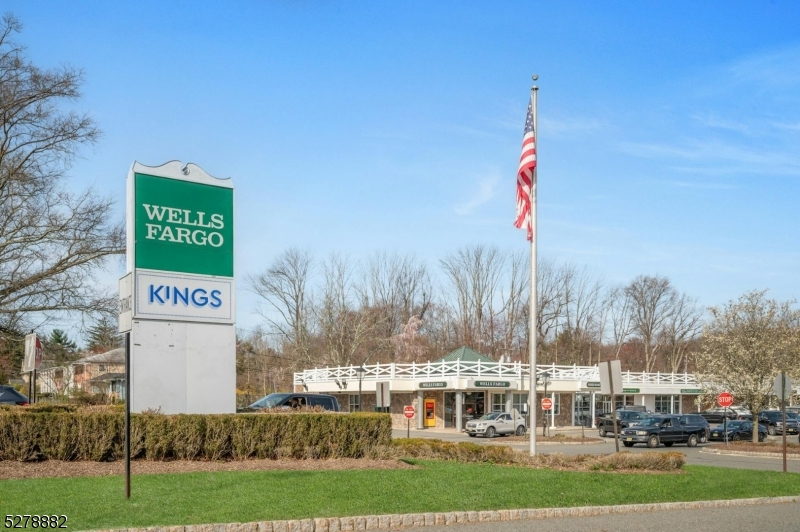 80 East Main Street, Unit 5 Mendham, NJ 07945 - Photo 24 of 28 a view of outdoor space with sign board and garden