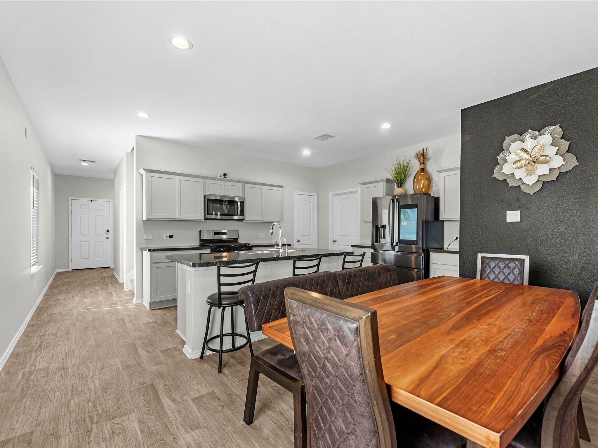 5455 Pinetree Crescent Ln Spring Spring, TX 77373 - Photo 12 of 25 Open concept living at it's finest. Dining space can seat 8+