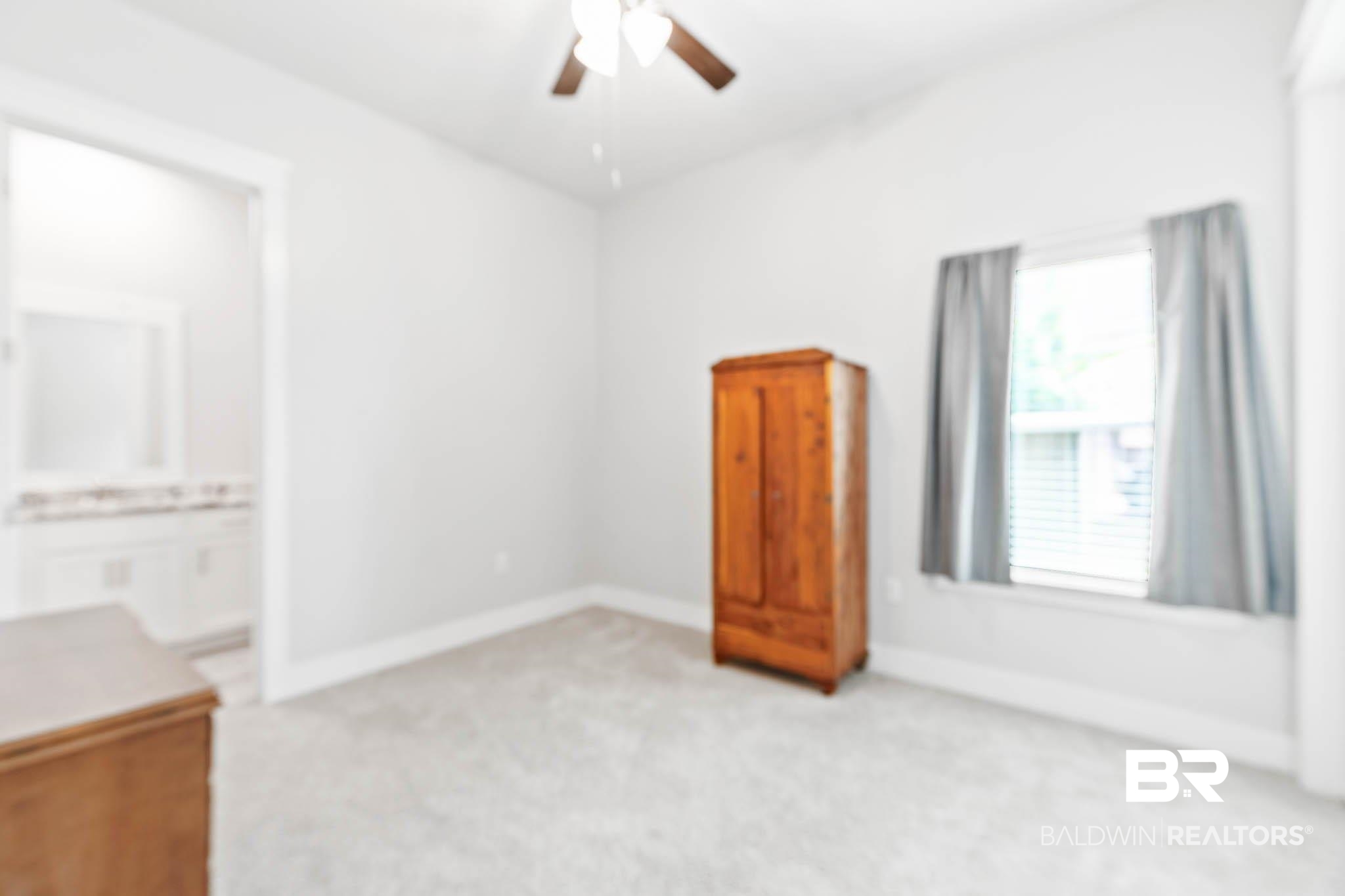 12785 Warbler Street Daphne, AL 36527 - Photo 19 of 53 Unfurnished bedroom featuring light carpet, a ceiling fan, and ensuite bath
