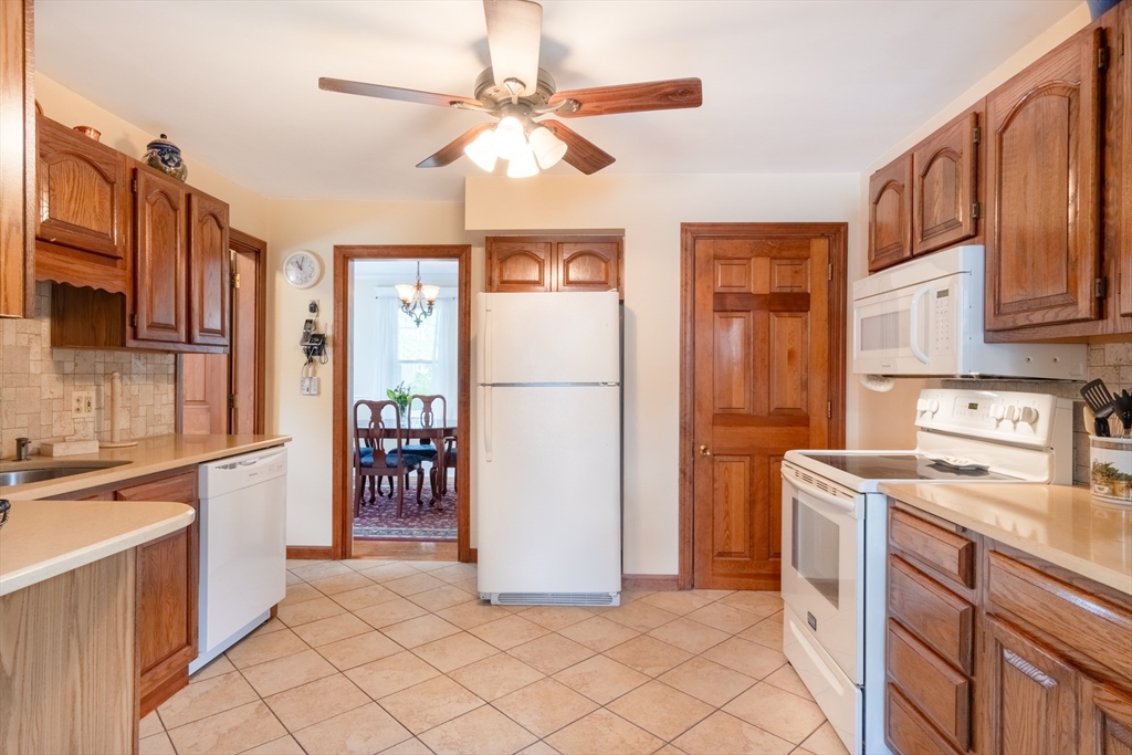 160 Abbott Street Springfield, MA 01118 - Photo 11 of 34 a kitchen with stainless steel appliances granite countertop a refrigerator a stove and a sink