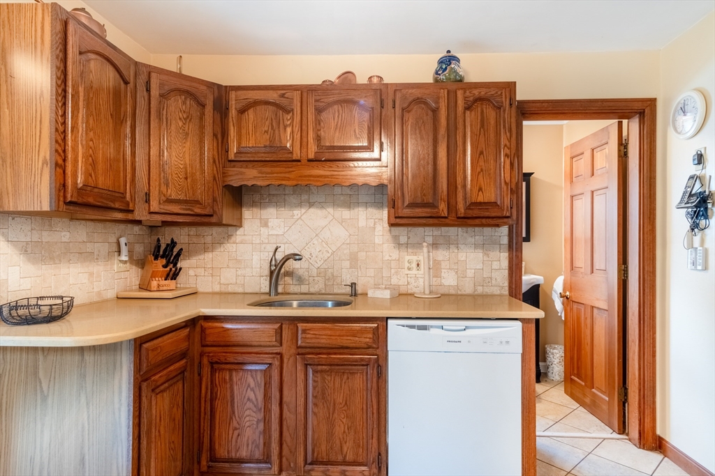 160 Abbott Street Springfield, MA 01118 - Photo 12 of 34 a kitchen with stainless steel appliances granite countertop a refrigerator and a sink