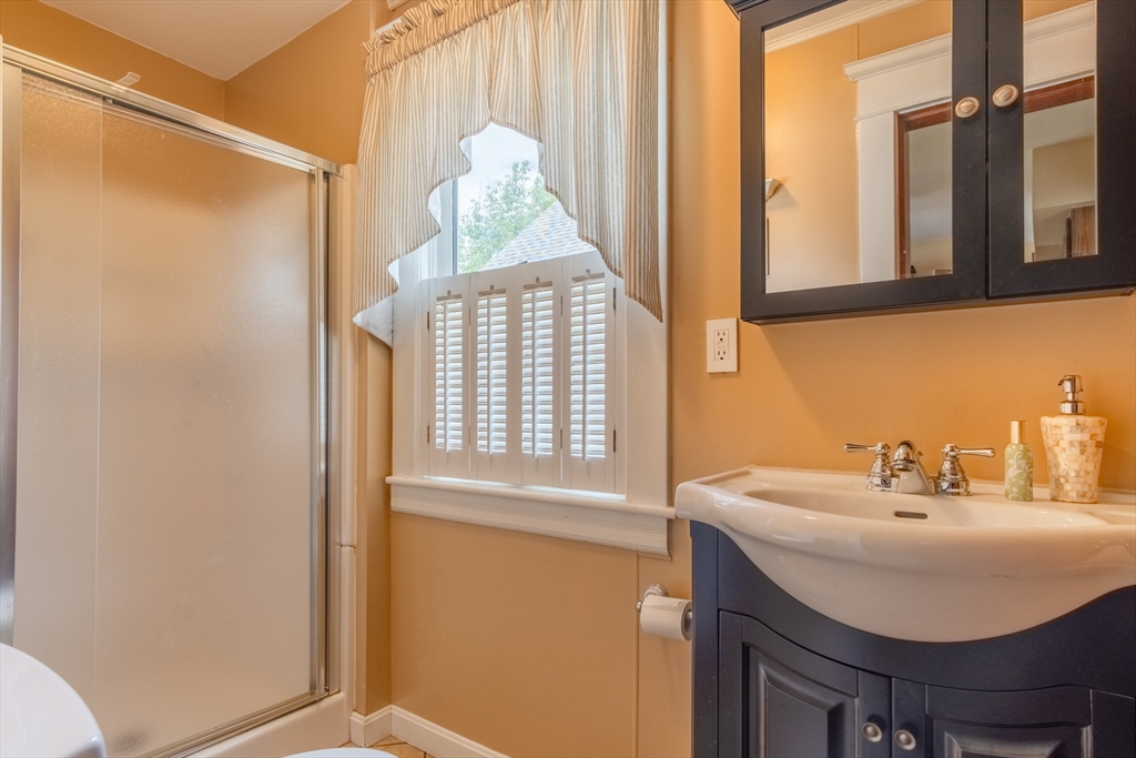 160 Abbott Street Springfield, MA 01118 - Photo 14 of 34 a bathroom with a sink and a mirror