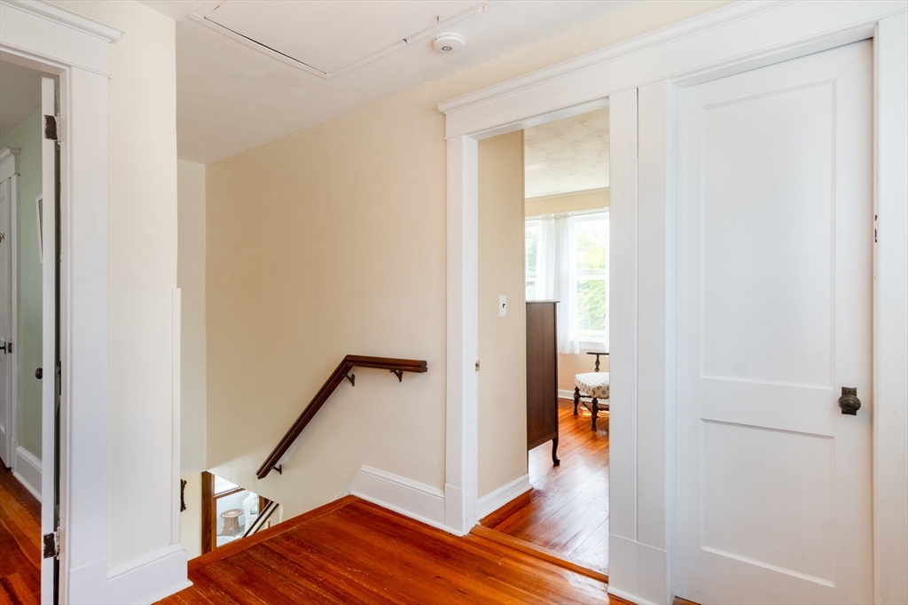 160 Abbott Street Springfield, MA 01118 - Photo 15 of 34 a view of a hallway with wooden floor and staircase