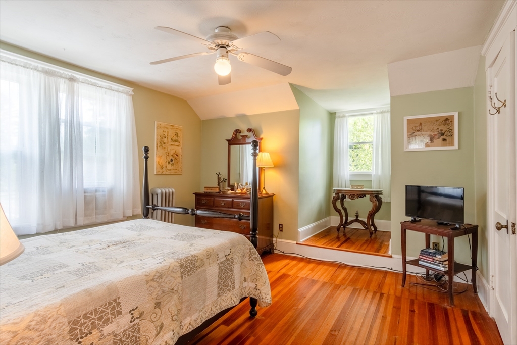 160 Abbott Street Springfield, MA 01118 - Photo 17 of 34 a bedroom with a bed and a chandelier