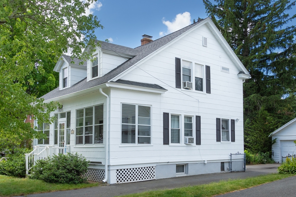 160 Abbott Street Springfield, MA 01118 - Photo 2 of 34 a view of a white house with large windows and a yard