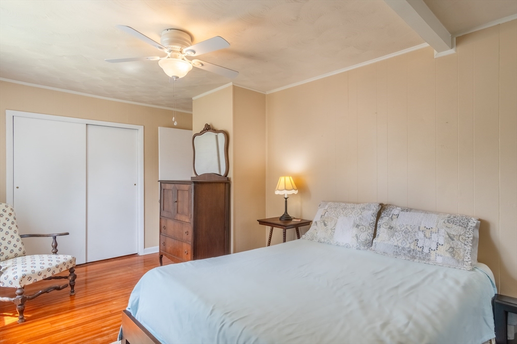 160 Abbott Street Springfield, MA 01118 - Photo 21 of 34 a bedroom with a bed and a chandelier
