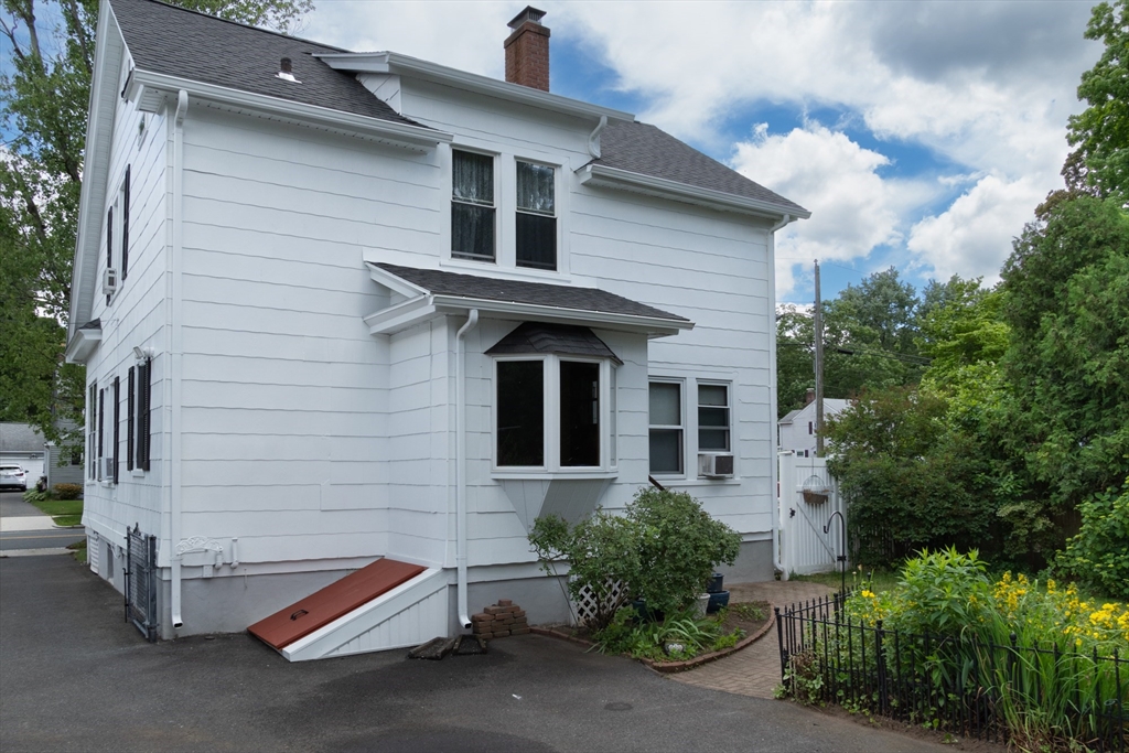 160 Abbott Street Springfield, MA 01118 - Photo 26 of 34 a front view of a house with a yard