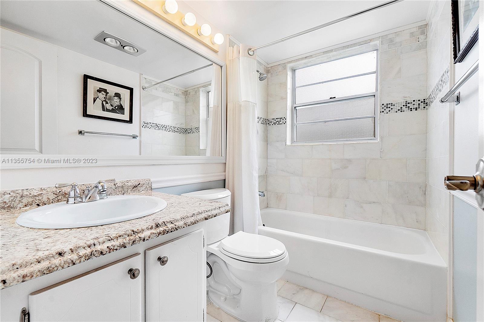 357 Durham, Unit 357 Deerfield Beach, FL 33442 - Photo 17 of 41 a bathroom with a granite countertop sink toilet and shower