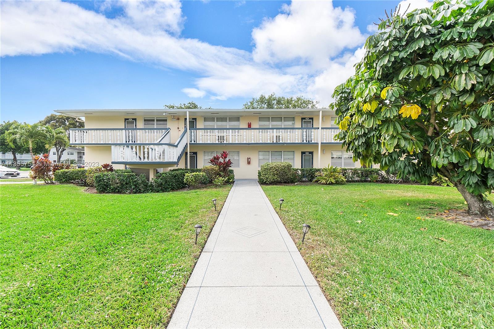 357 Durham, Unit 357 Deerfield Beach, FL 33442 - Photo 20 of 41 a view of a house with a yard