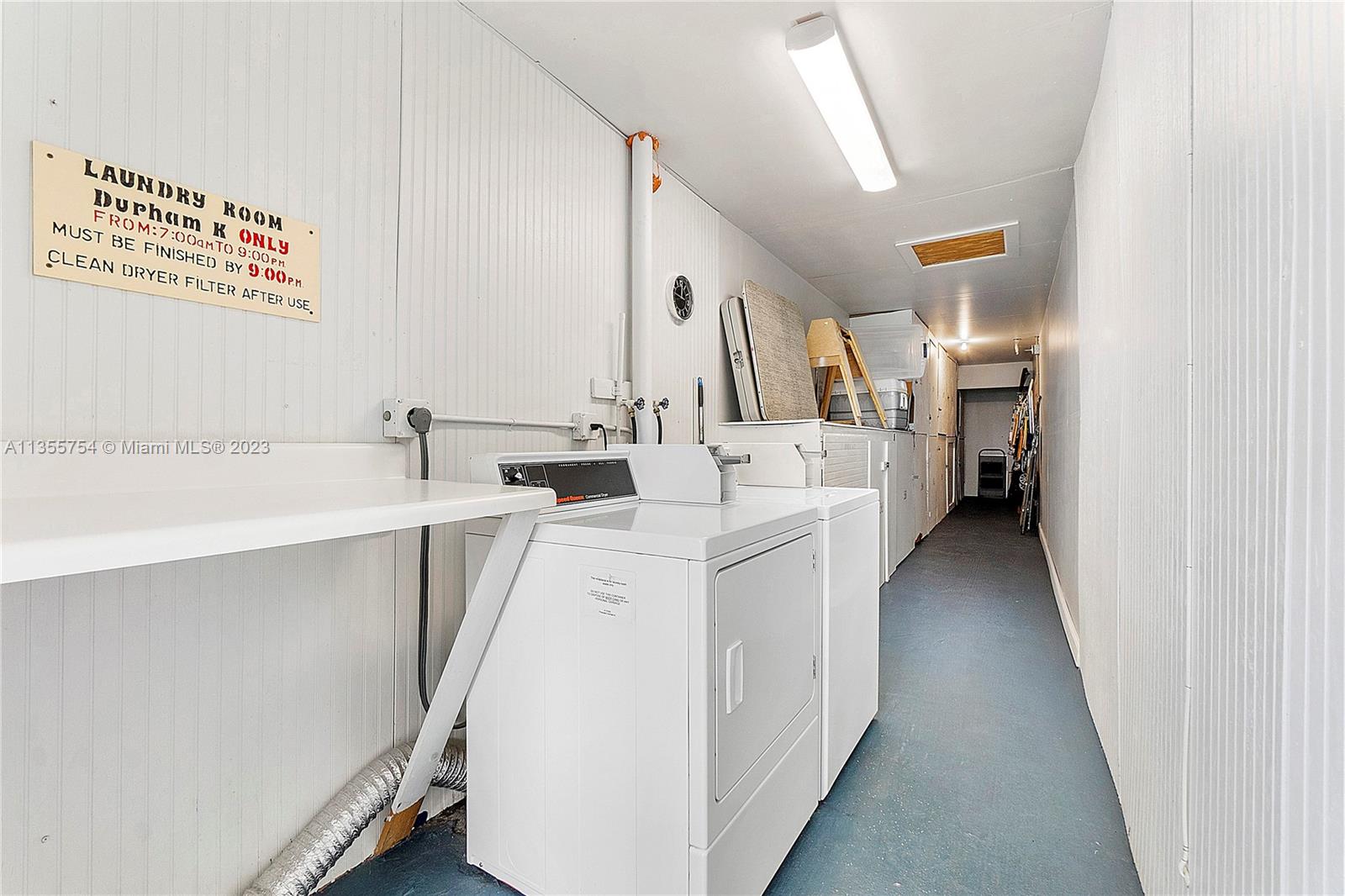 357 Durham, Unit 357 Deerfield Beach, FL 33442 - Photo 26 of 41 a utility room with cabinets washer and dryer