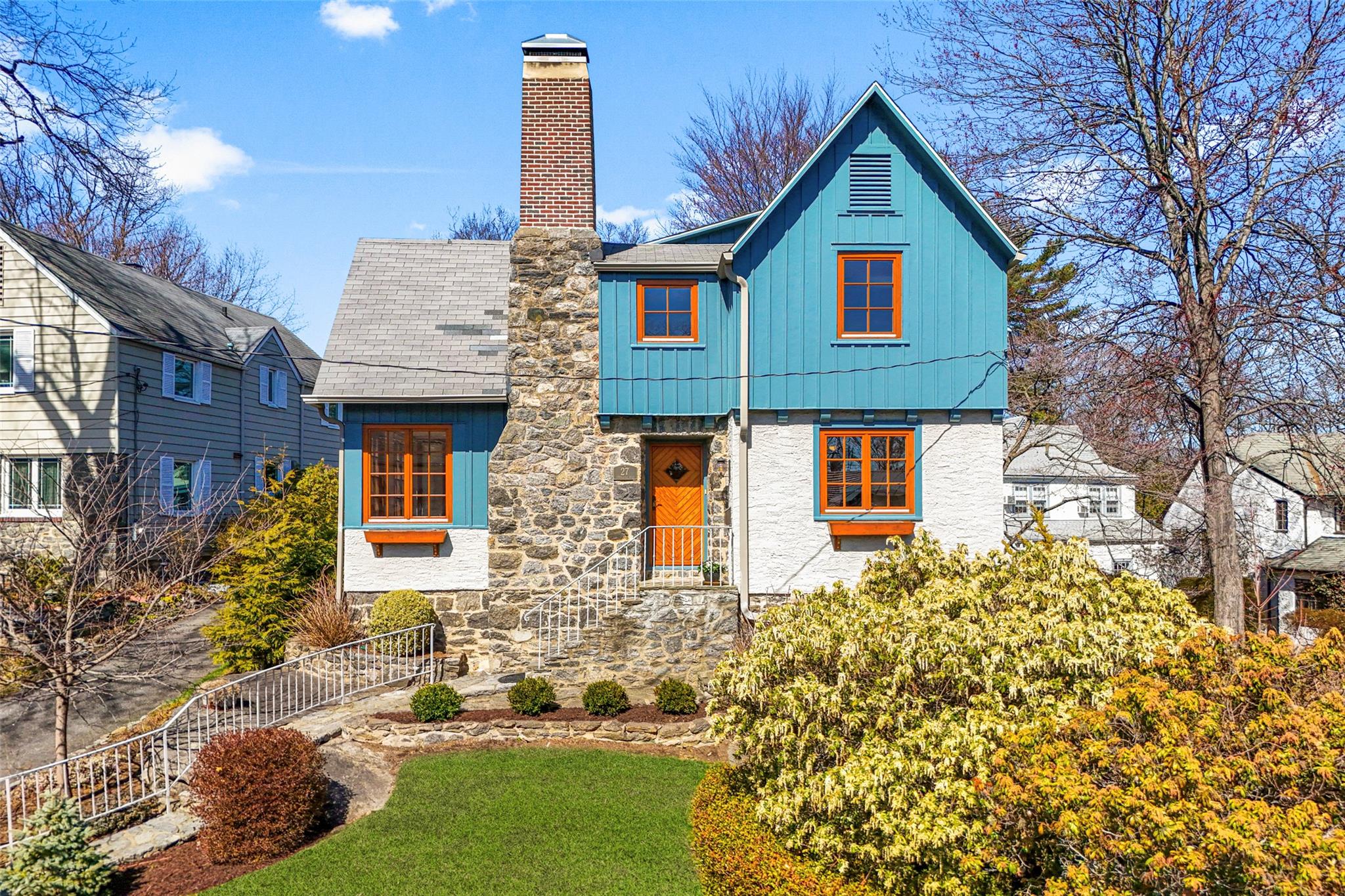 a front view of a house with garden