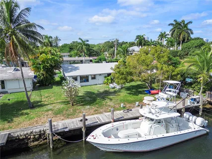 a view of a backyard with sitting area