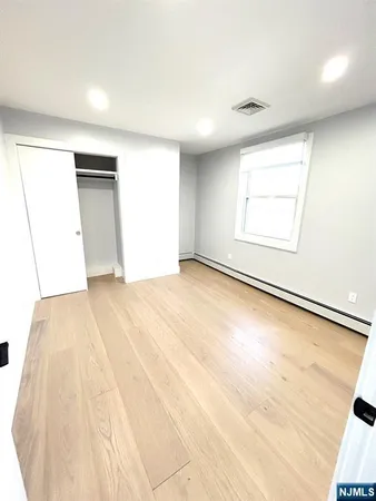 an empty room with a empty space and window