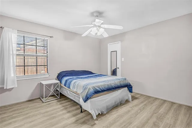 a bedroom with a bed and window