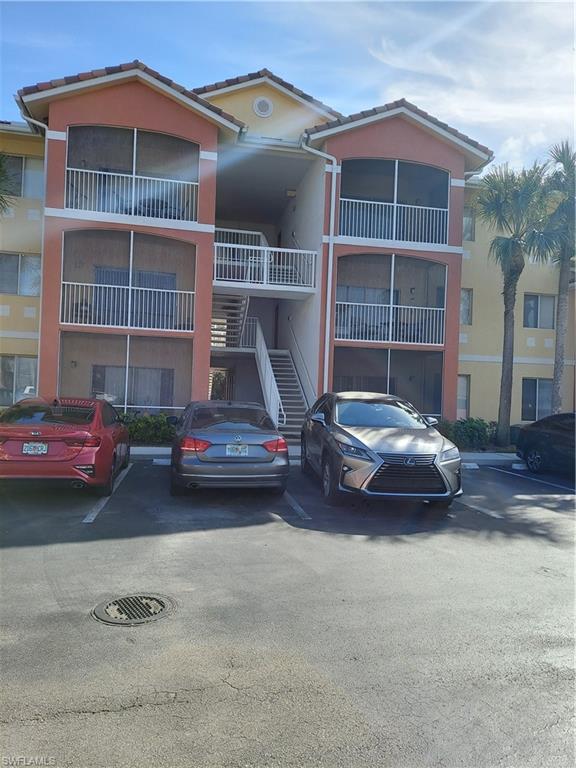 6341 Aragon Way, Unit 106 Fort Myers, FL 33966 - Photo 1 of 29 a car parked in front of a house
