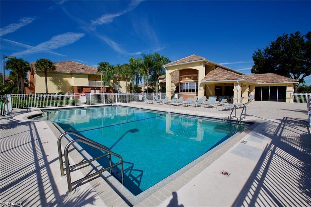 6341 Aragon Way, Unit 106 Fort Myers, FL 33966 - Photo 26 of 29 a swimming pool with outdoor seating and yard