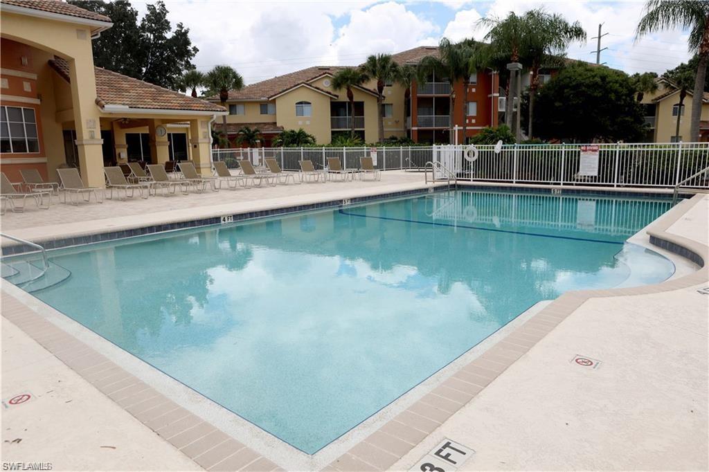6341 Aragon Way, Unit 106 Fort Myers, FL 33966 - Photo 27 of 29 a view of a lake with a house and outdoor space