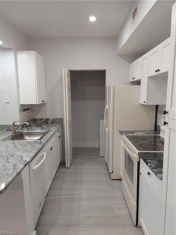 6341 Aragon Way, Unit 106 Fort Myers, FL 33966 - Photo 6 of 29 a kitchen with a sink stove and refrigerator