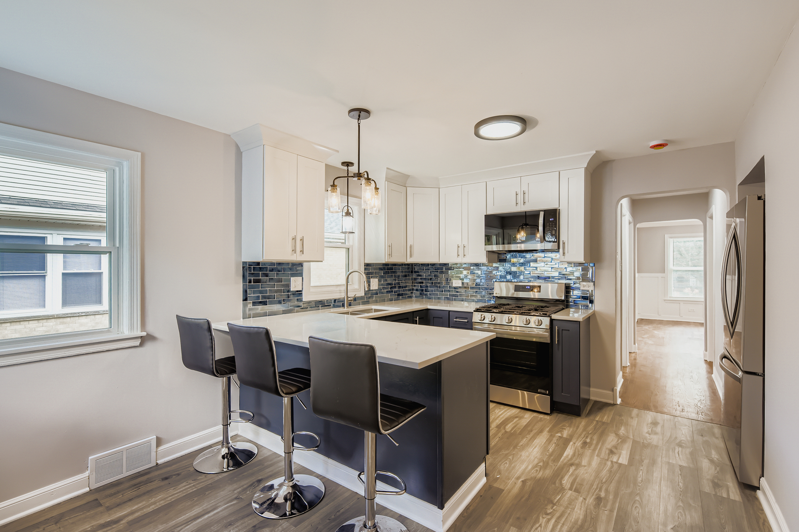 1918 West 108th Place Chicago, IL 60643 - Photo 4 of 12 a kitchen with a stove a sink and a refrigerator