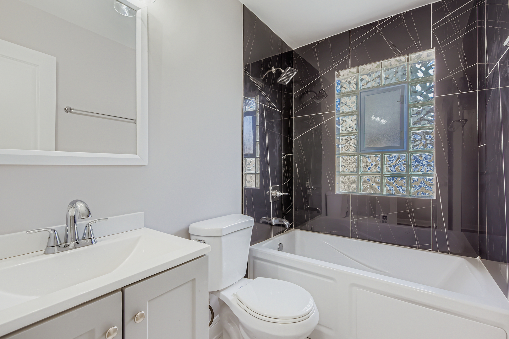 1918 West 108th Place Chicago, IL 60643 - Photo 6 of 12 a bathroom with a sink toilet and shower