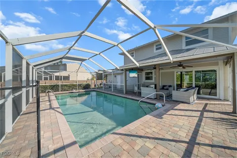 a view of a backyard with sitting area