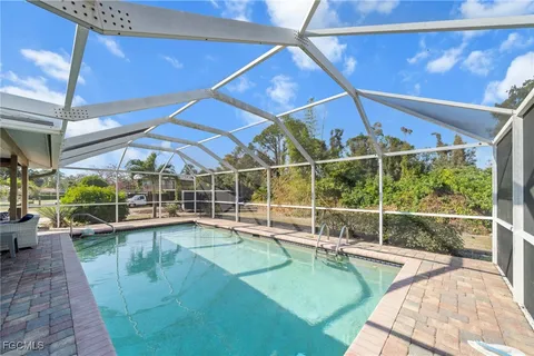 a view of a swimming pool with a patio