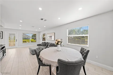 a view of a dining room with furniture window and outside view
