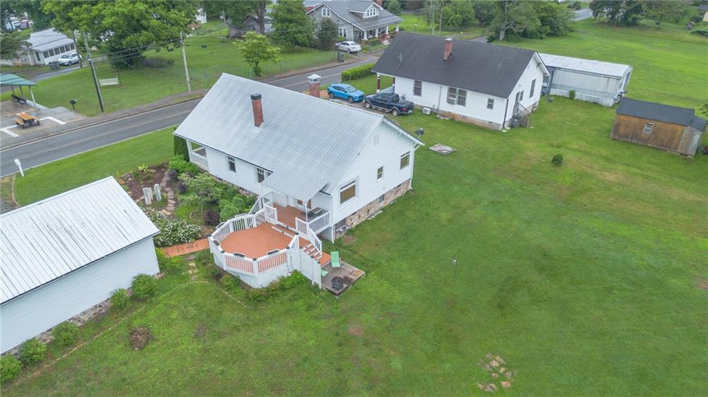1815 Pickens Street Ball Ground, GA 30107 - Photo 38 of 38 an aerial view of a house with a garden and lake view