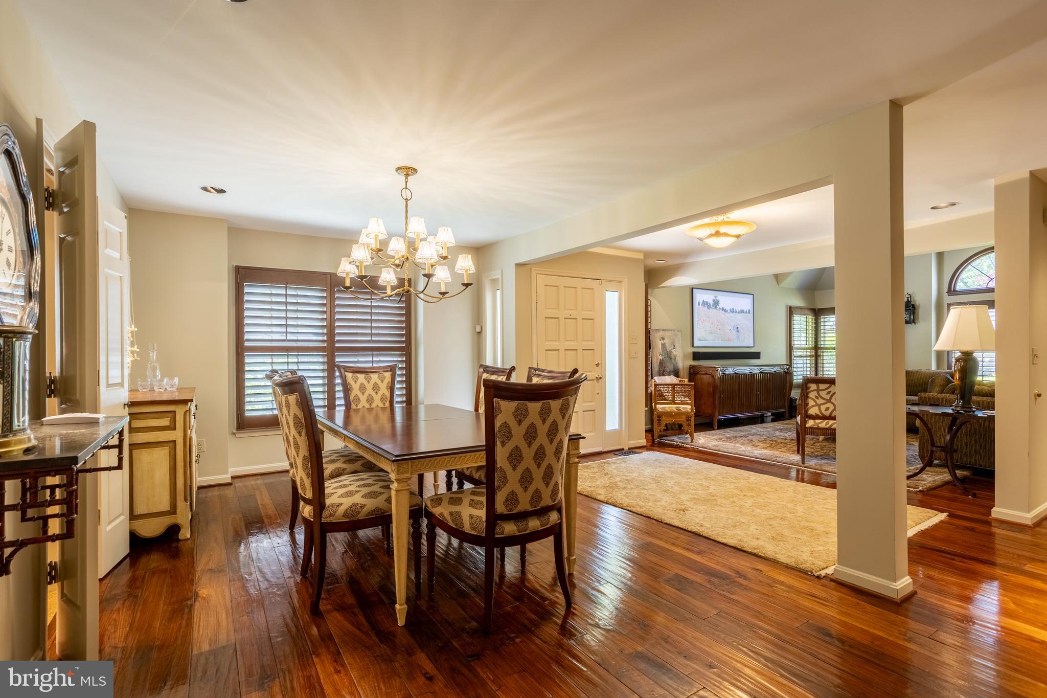 63 Raisin Tree Circle Baltimore, MD 21208 - Photo 11 of 57 a view of a dining room with furniture window and wooden floor