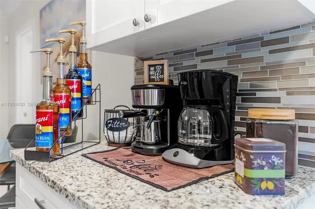 a living room with lots of furniture and a fireplace