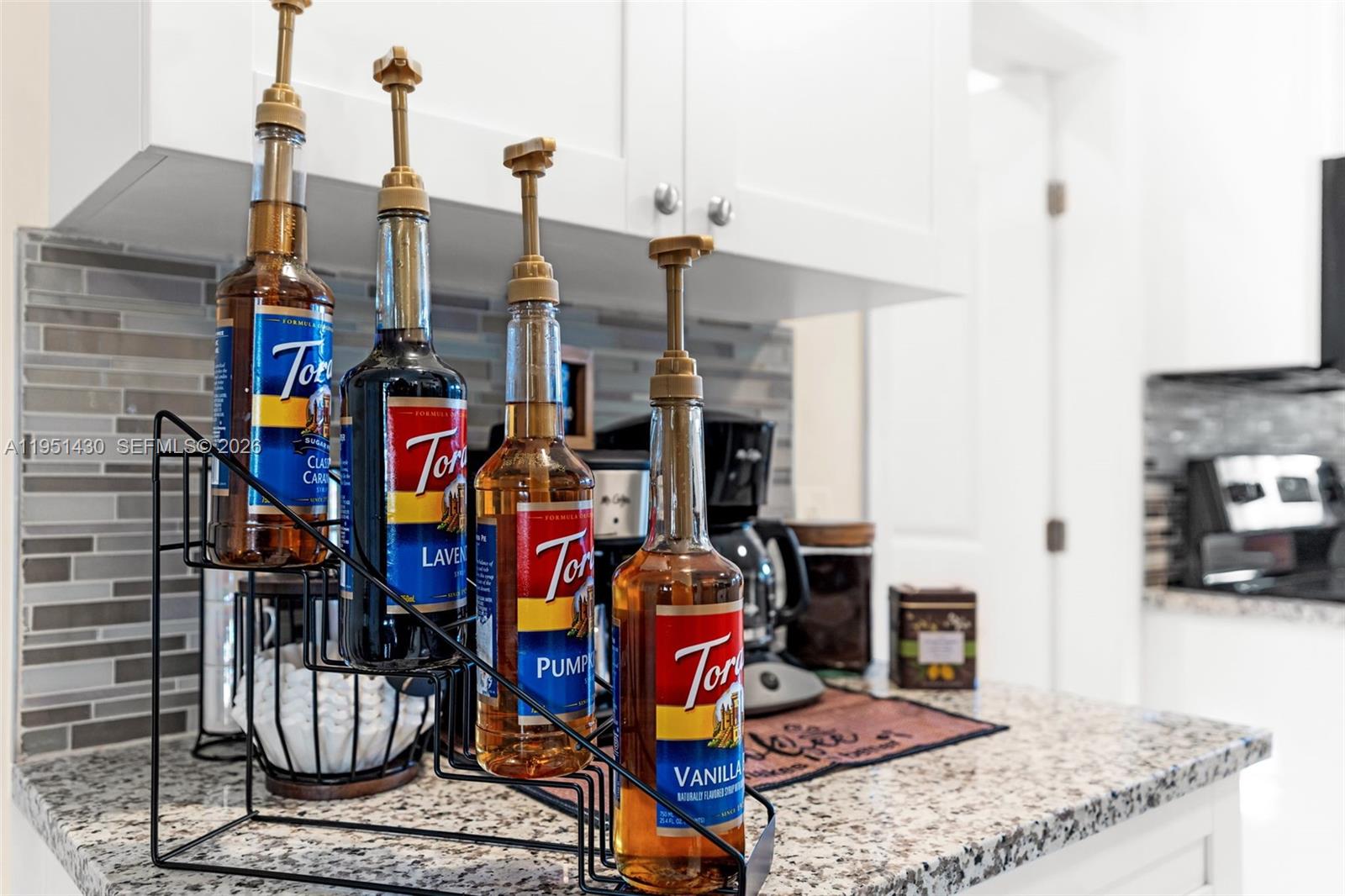 1075 Northeast 12th Avenue, Unit 1075 Homestead, FL 33033 - Photo 14 of 49 a living room with lots of furniture and a fireplace