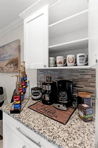 a kitchen with a stove and cabinets