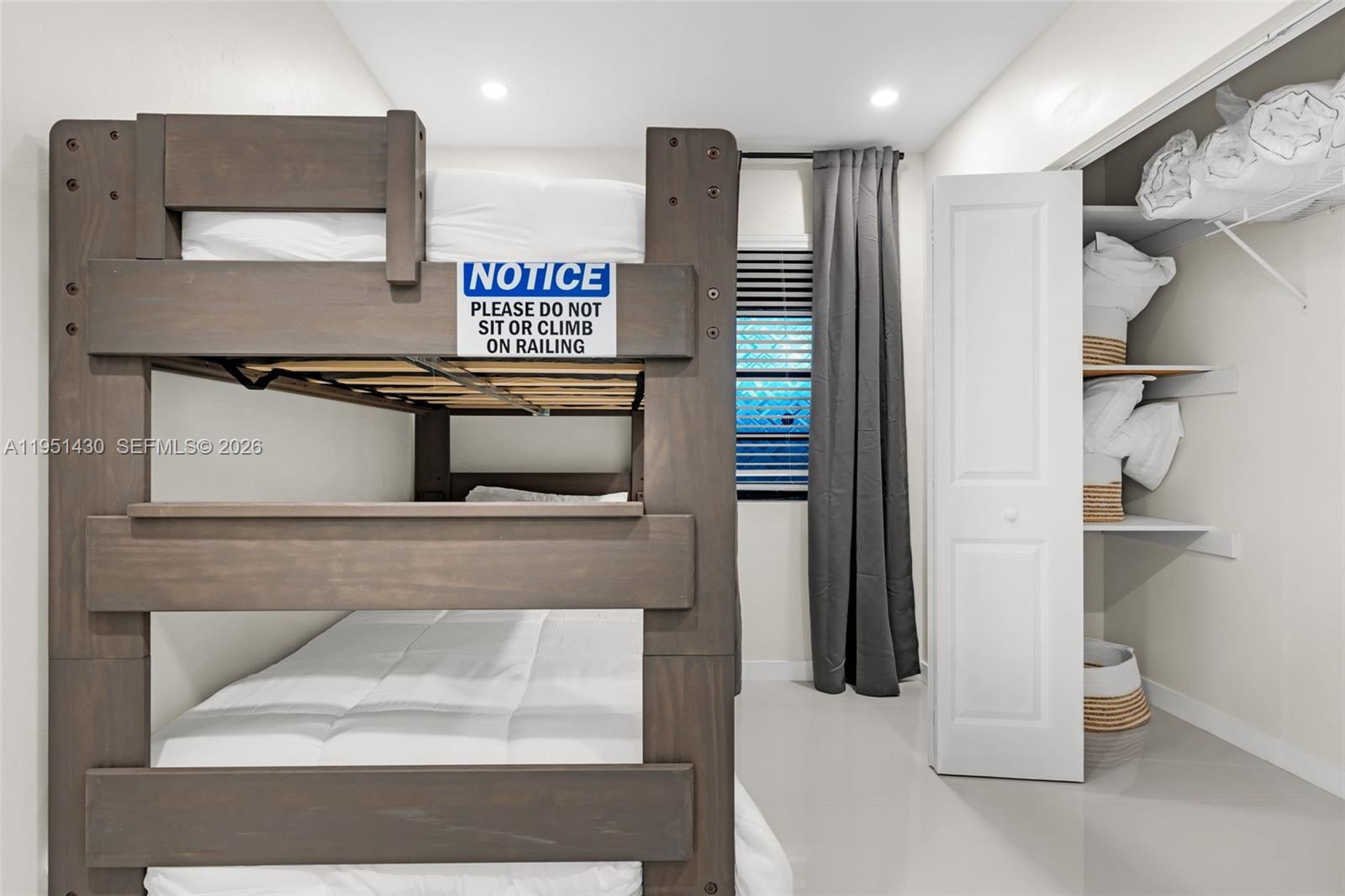 1075 Northeast 12th Avenue, Unit 1075 Homestead, FL 33033 - Photo 29 of 49 a kitchen with stainless steel appliances kitchen island a refrigerator and a stove