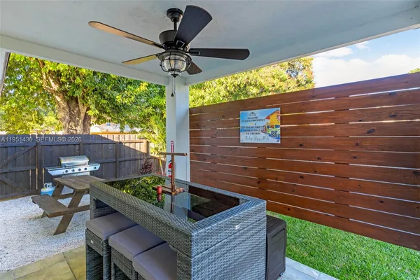 a front view of house with yard and outdoor seating