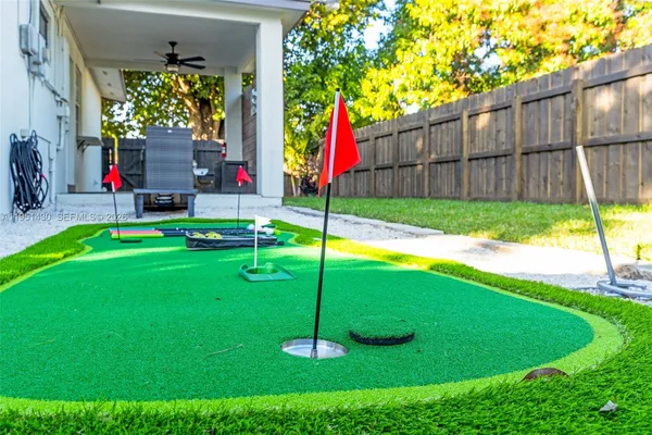 a backyard of a house table and chairs
