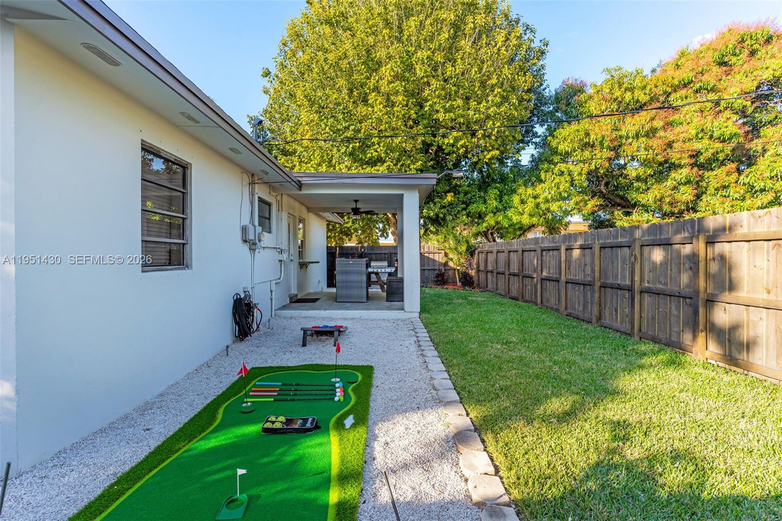 1075 Northeast 12th Avenue, Unit 1075 Homestead, FL 33033 - Photo 36 of 49 a front view of a house with garden