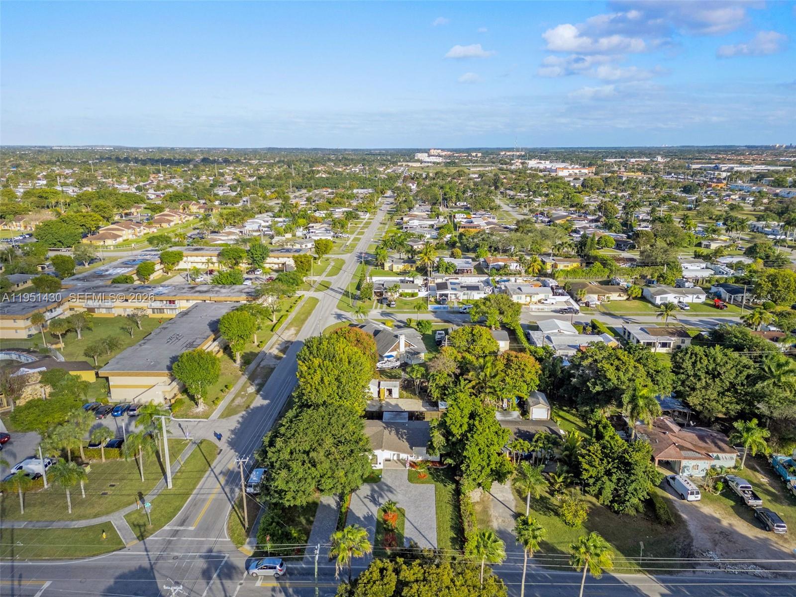 1075 Northeast 12th Avenue, Unit 1075 Homestead, FL 33033 - Photo 39 of 49 an aerial view of residential building and lake