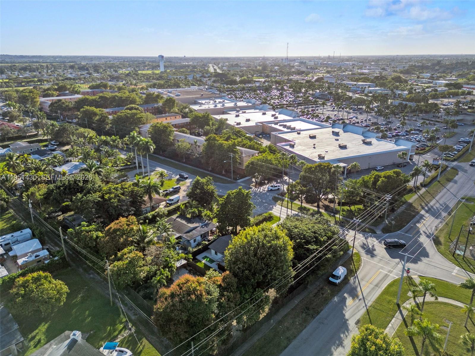 1075 Northeast 12th Avenue, Unit 1075 Homestead, FL 33033 - Photo 45 of 49 an aerial view of residential houses with city view