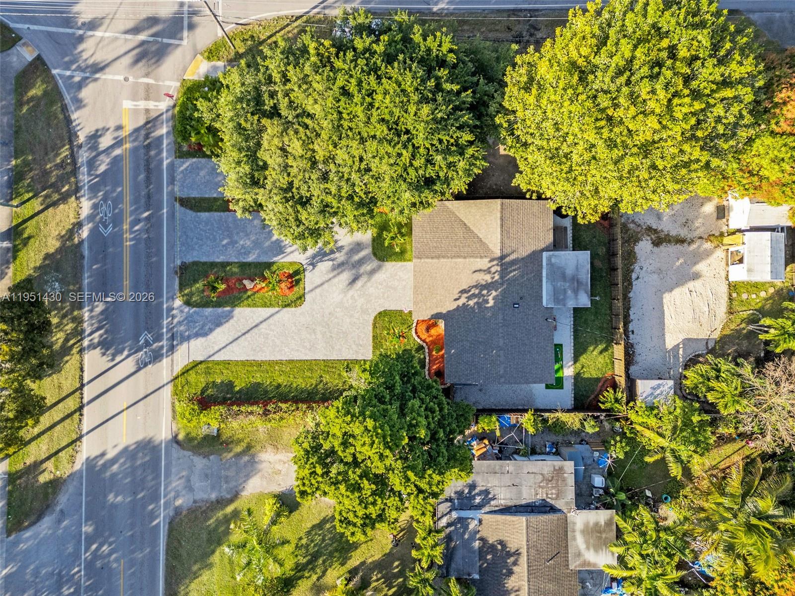1075 Northeast 12th Avenue, Unit 1075 Homestead, FL 33033 - Photo 49 of 49 an aerial view of a house with a yard swimming pool and outdoor seating