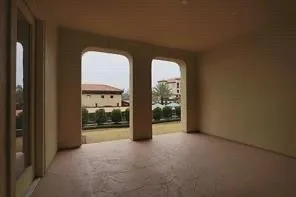 a view of a patio with chairs and table in the patio
