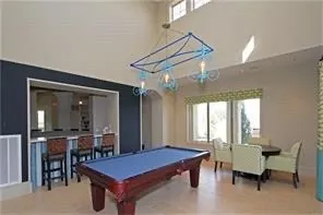 a living room with fireplace furniture and a chandelier