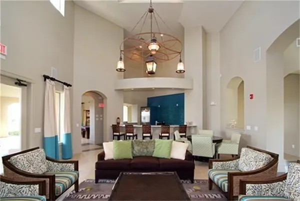 a view of a swimming pool with outdoor seating